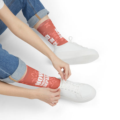 Woman wearing Go in Peace bible socks