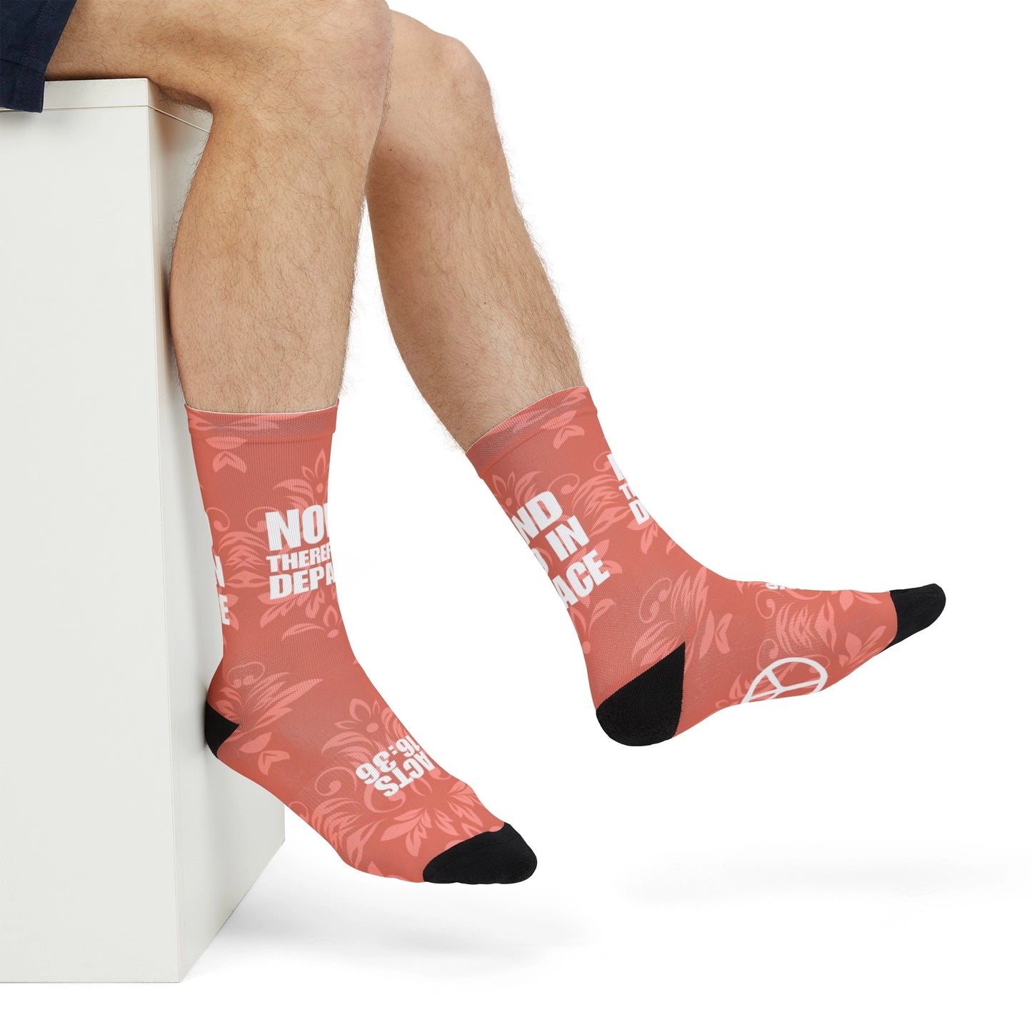 Man wearing Go in Peace bible socks