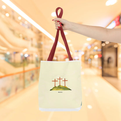 Woman holding Believe in Christ tote bag