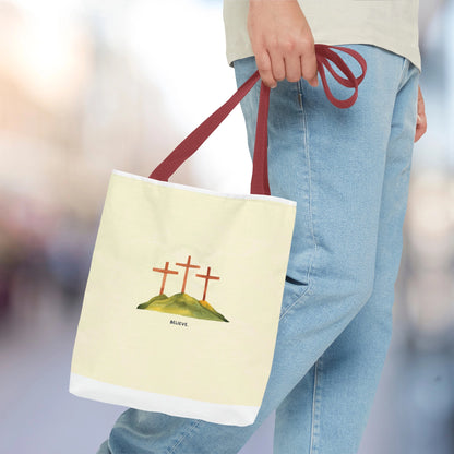 Man carrying Believe in Christ tote bag