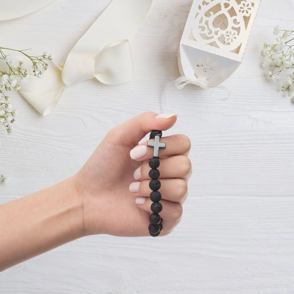 Woman holding Christian bead bracelet 