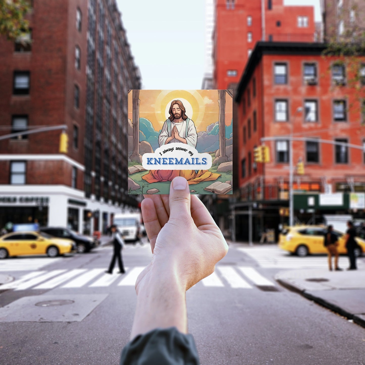 Hand holding up Funny Jesus sticker kneemails