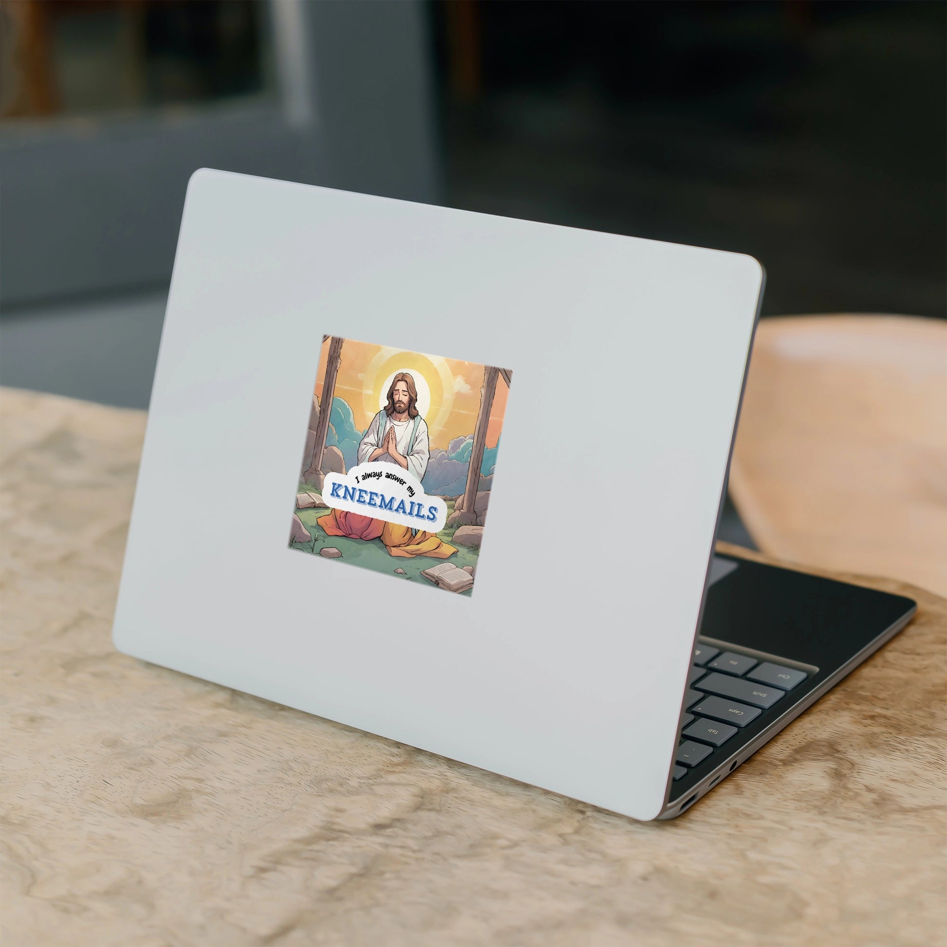 Funny Jesus sticker kneemails on laptop