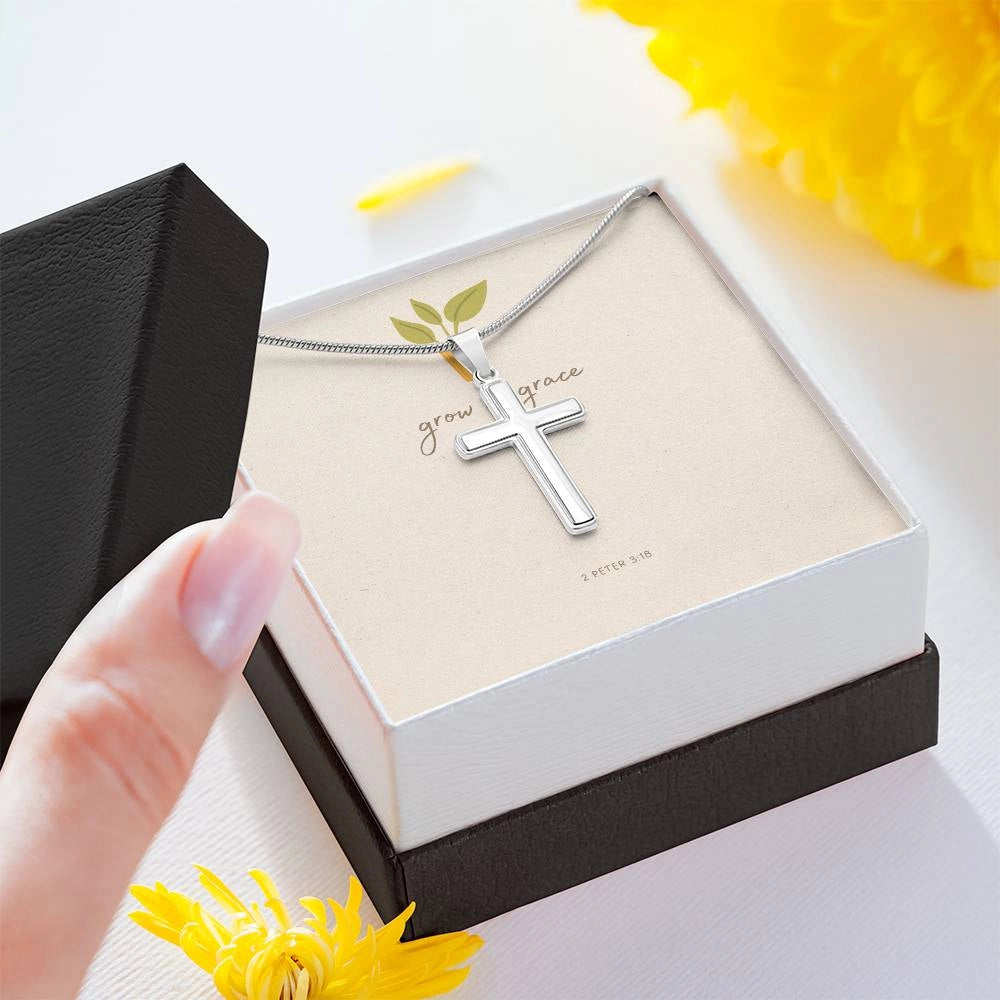 Woman's hand opening Grow in Grace Cross Faith Necklace