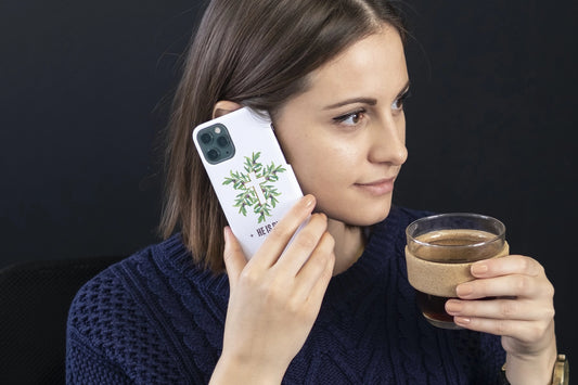 Woman holding He is Riden phone case
